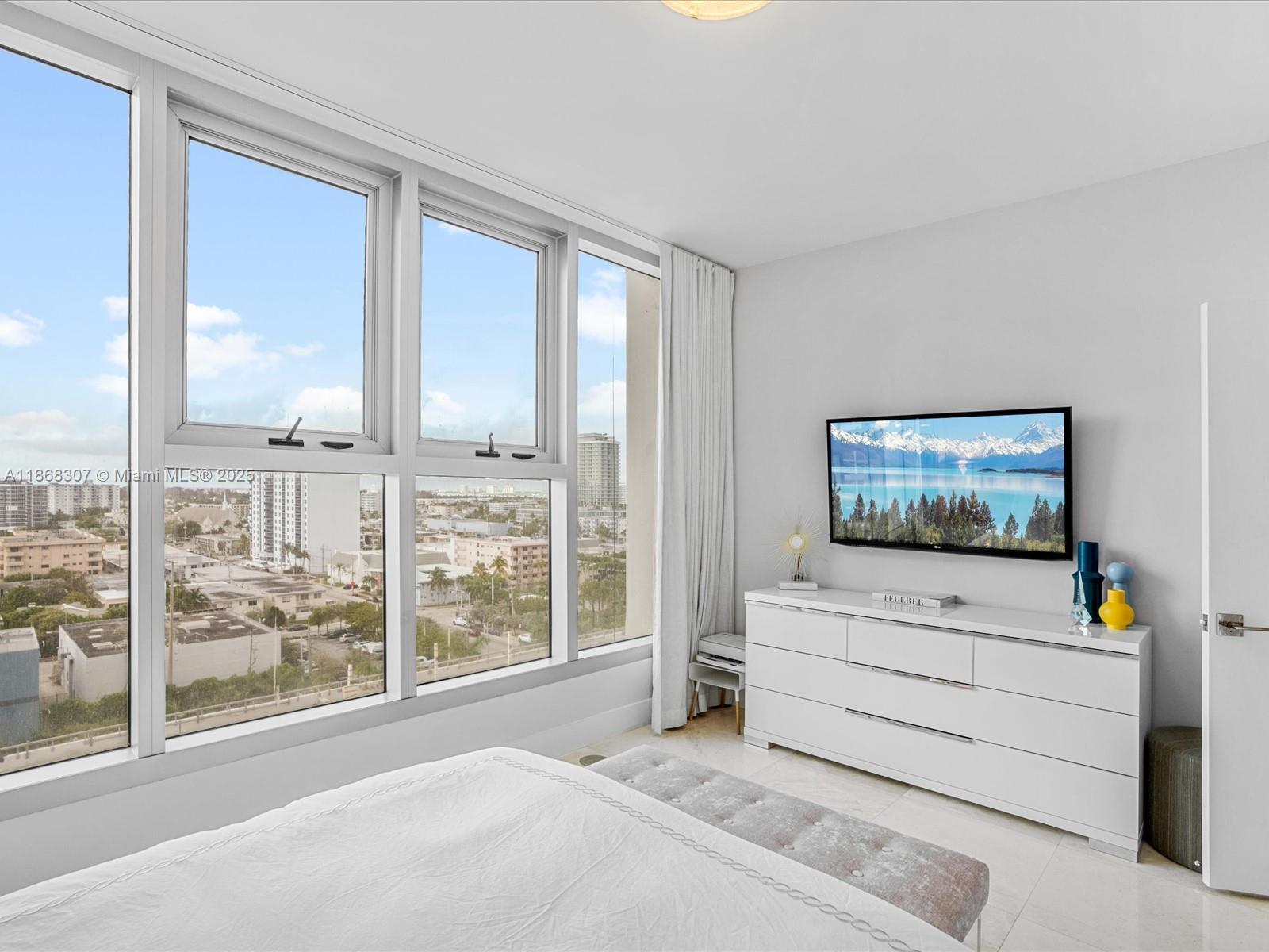 6899 Collins Avenue, Unit 1010 Miami Beach, FL 33141 - Photo 20 of 37 a view of a room with furniture and windows