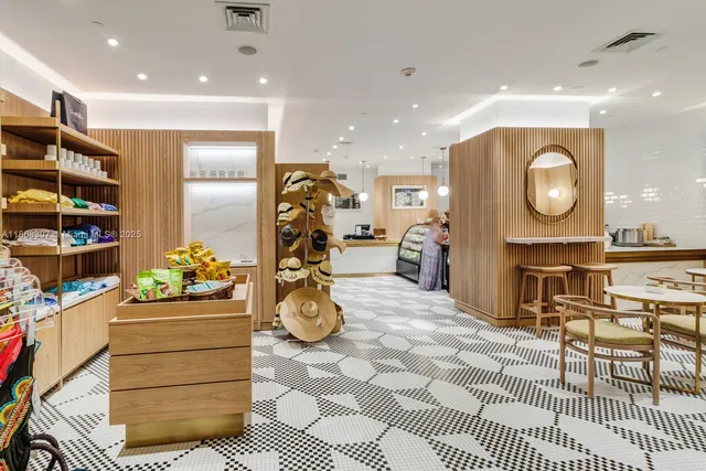 a room with furniture a flat screen tv and a fireplace