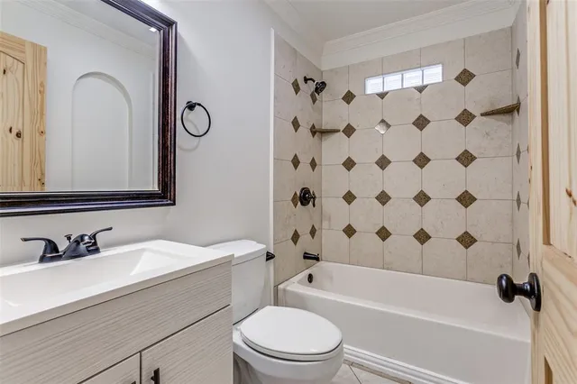 a bathroom with a sink a toilet and a bathtub