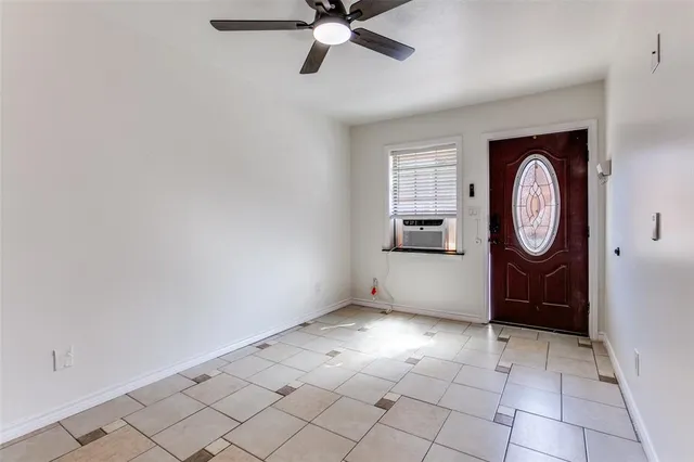 a view of an entryway with wooden floor and mirror