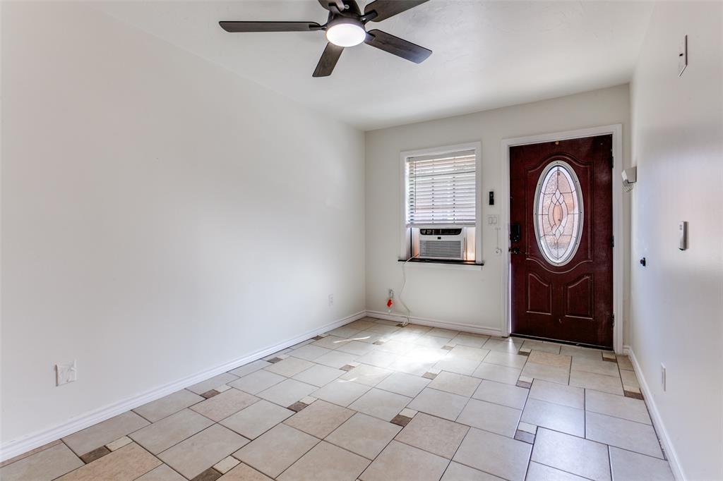 110 Ocean Drive Richardson, TX 75081 - Photo 16 of 20 a view of an entryway with wooden floor and mirror