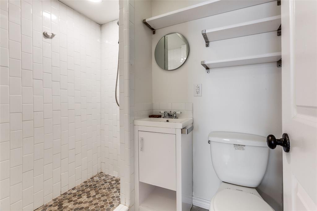 110 Ocean Drive Richardson, TX 75081 - Photo 19 of 20 a bathroom with a toilet and a shower