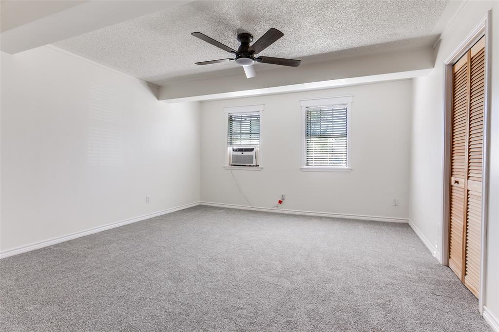 110 Ocean Drive Richardson, TX 75081 - Photo 20 of 20 an empty room with windows and ceiling fan