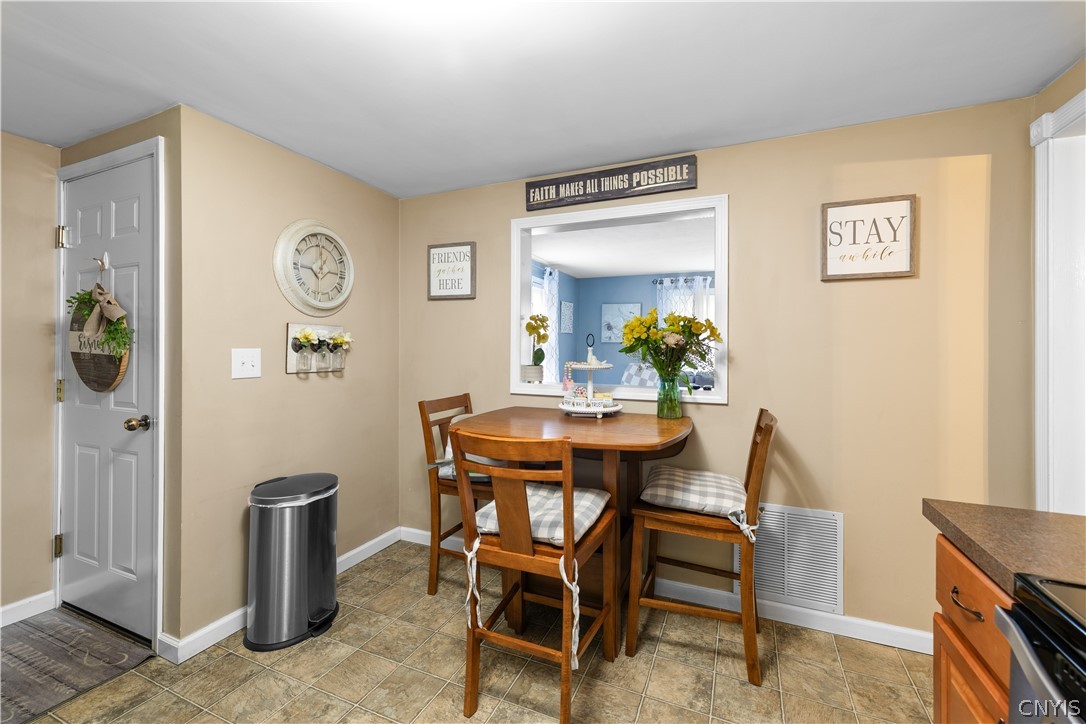 5464 Kenwood Road Utica, NY 13502 - Photo 8 of 19 Dining Area With View of Living Room