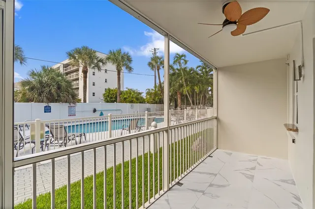 a kitchen with granite countertop a refrigerator stove and microwave