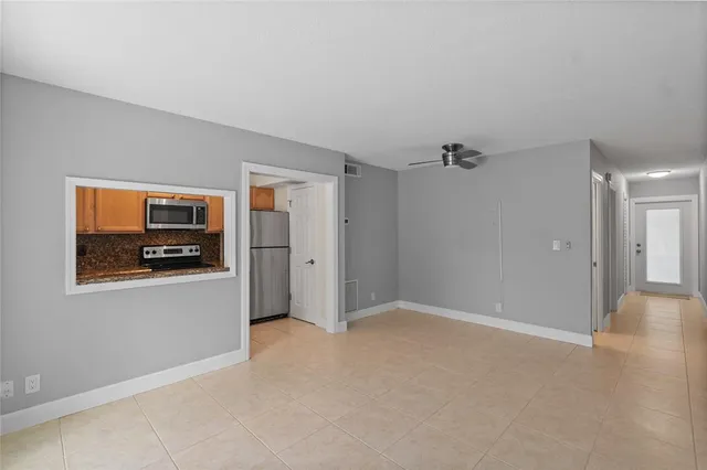 a view of an empty room with a window