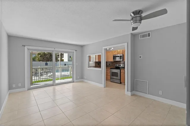 a bathroom with a toilet a sink a mirror and vanity