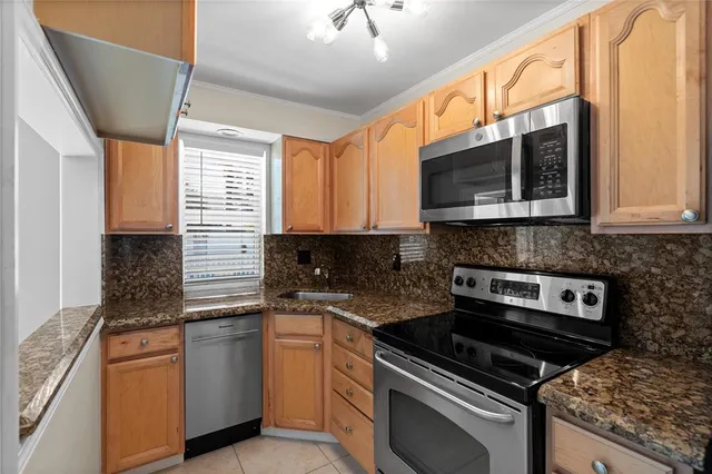 a bathroom with a toilet sink vanity and mirror