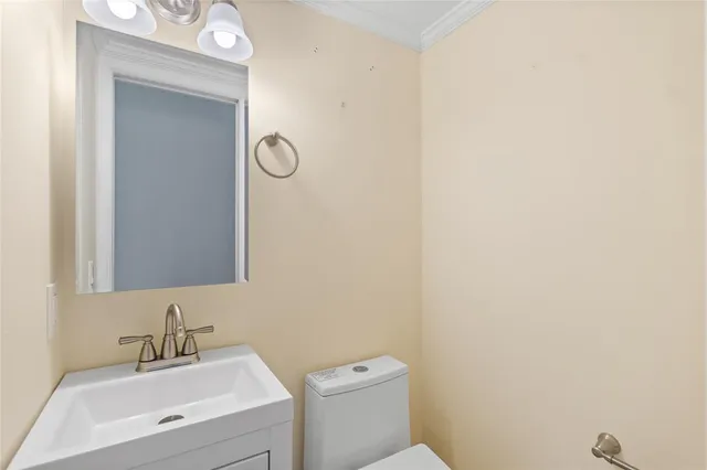 an empty room with closet and a chandelier fan