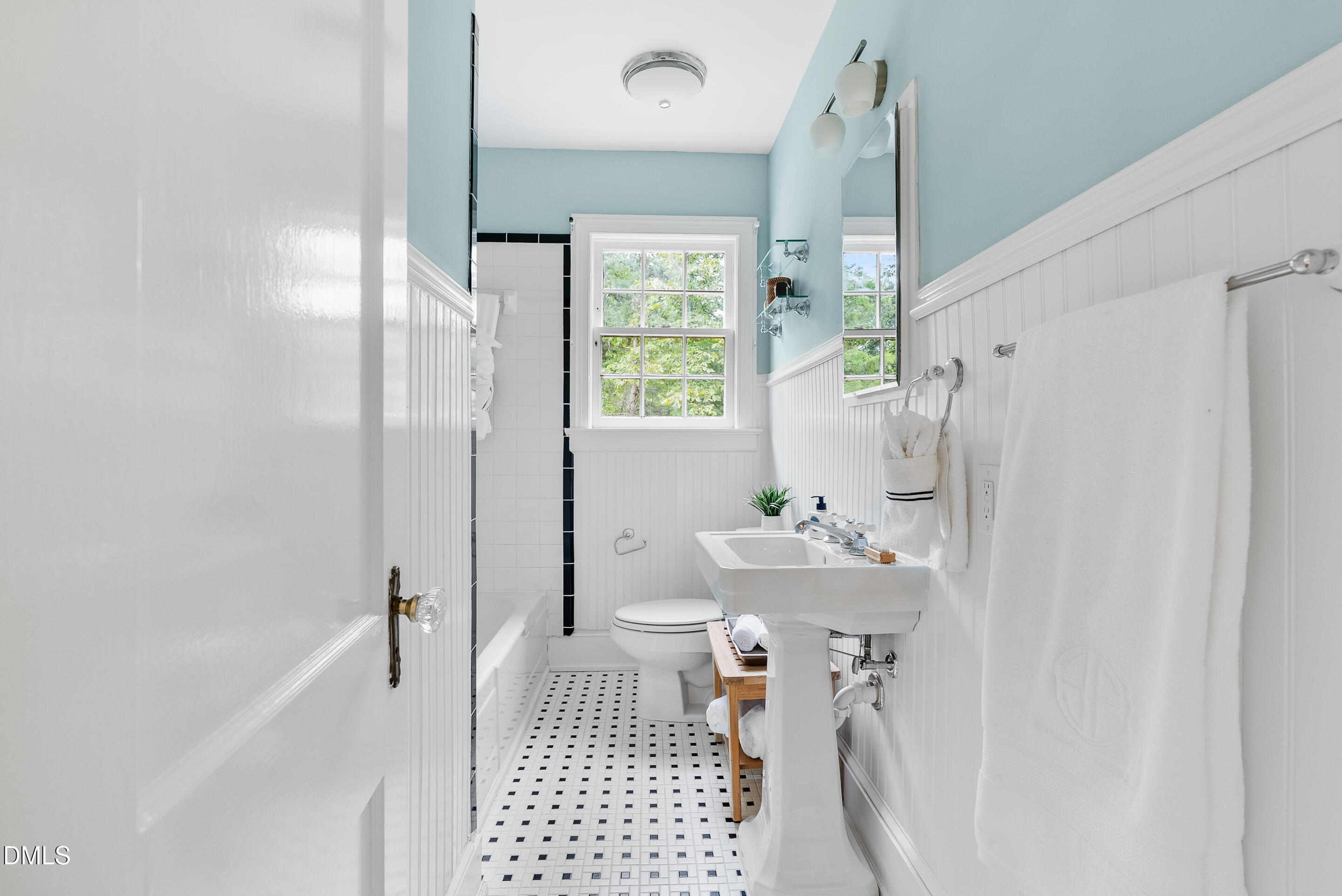 1702 James Street Durham, NC 27707 - Photo 14 of 21 a bathroom with a sink a toilet and shower