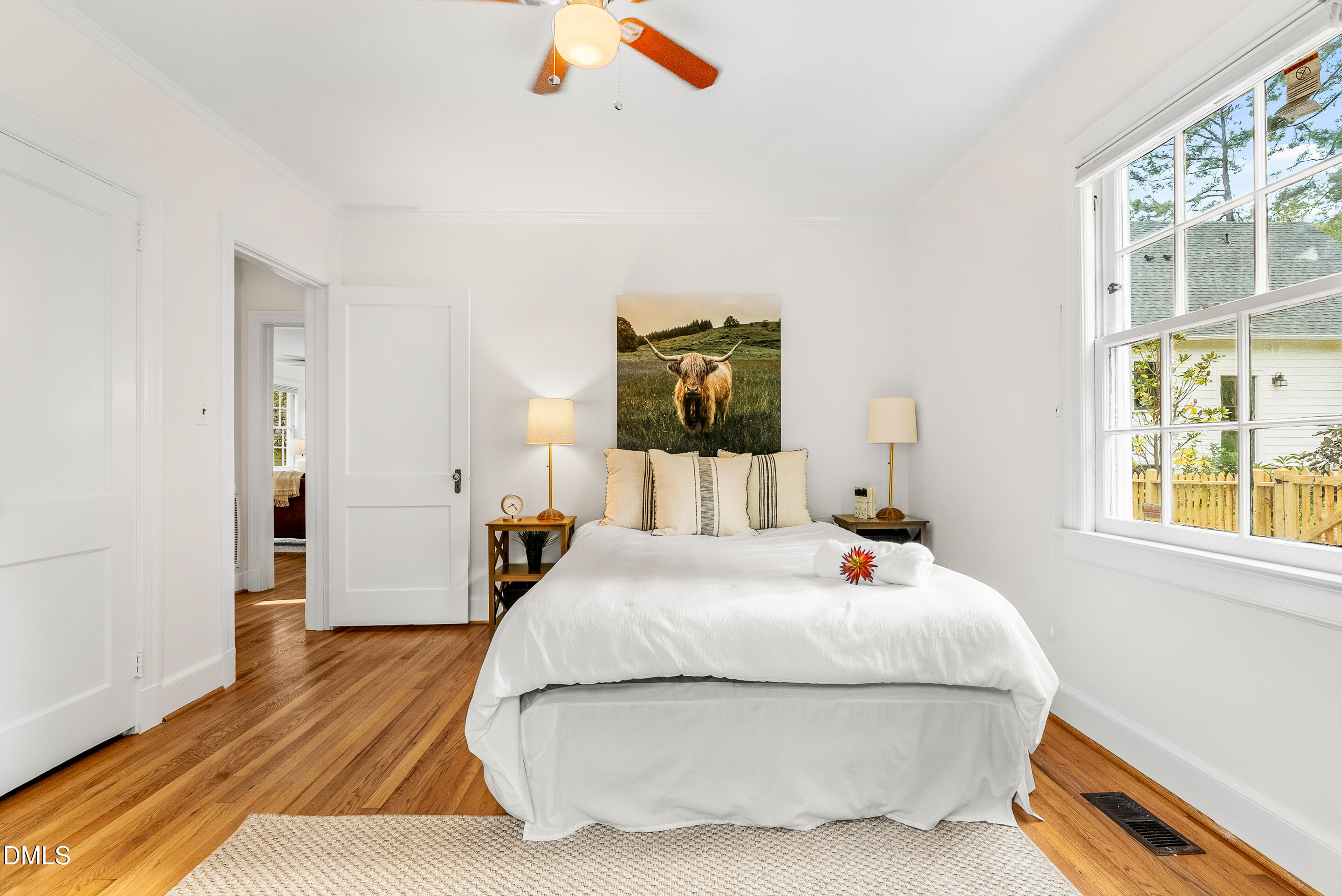 1702 James Street Durham, NC 27707 - Photo 17 of 21 a bedroom with a bed and wooden floor