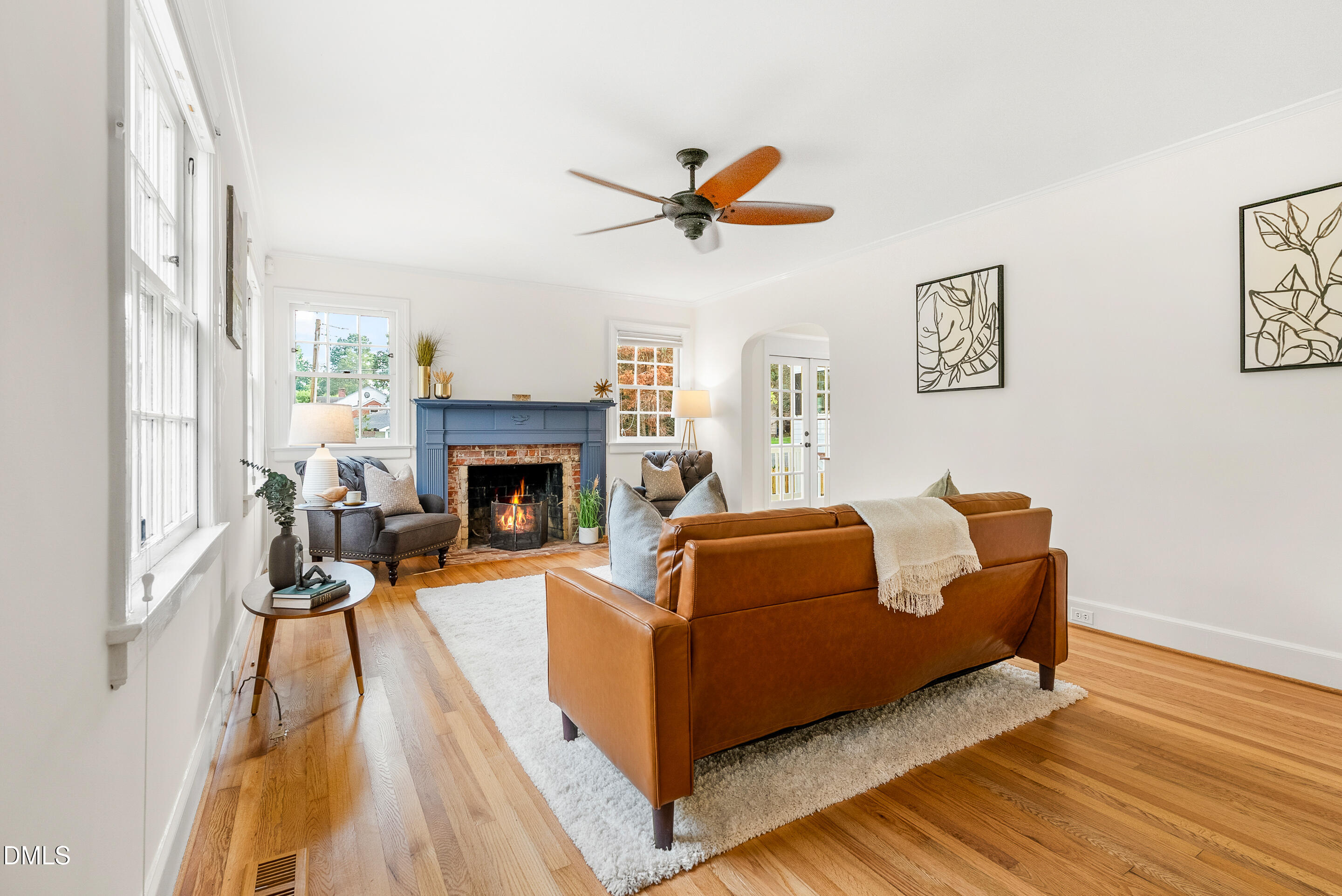 1702 James Street Durham, NC 27707 - Photo 4 of 21 a living room with couches fireplace and a wooden floor