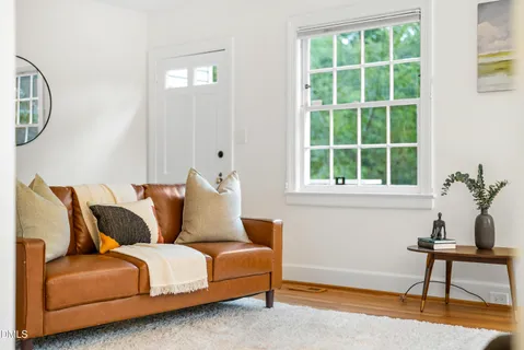 a living room with furniture and a window