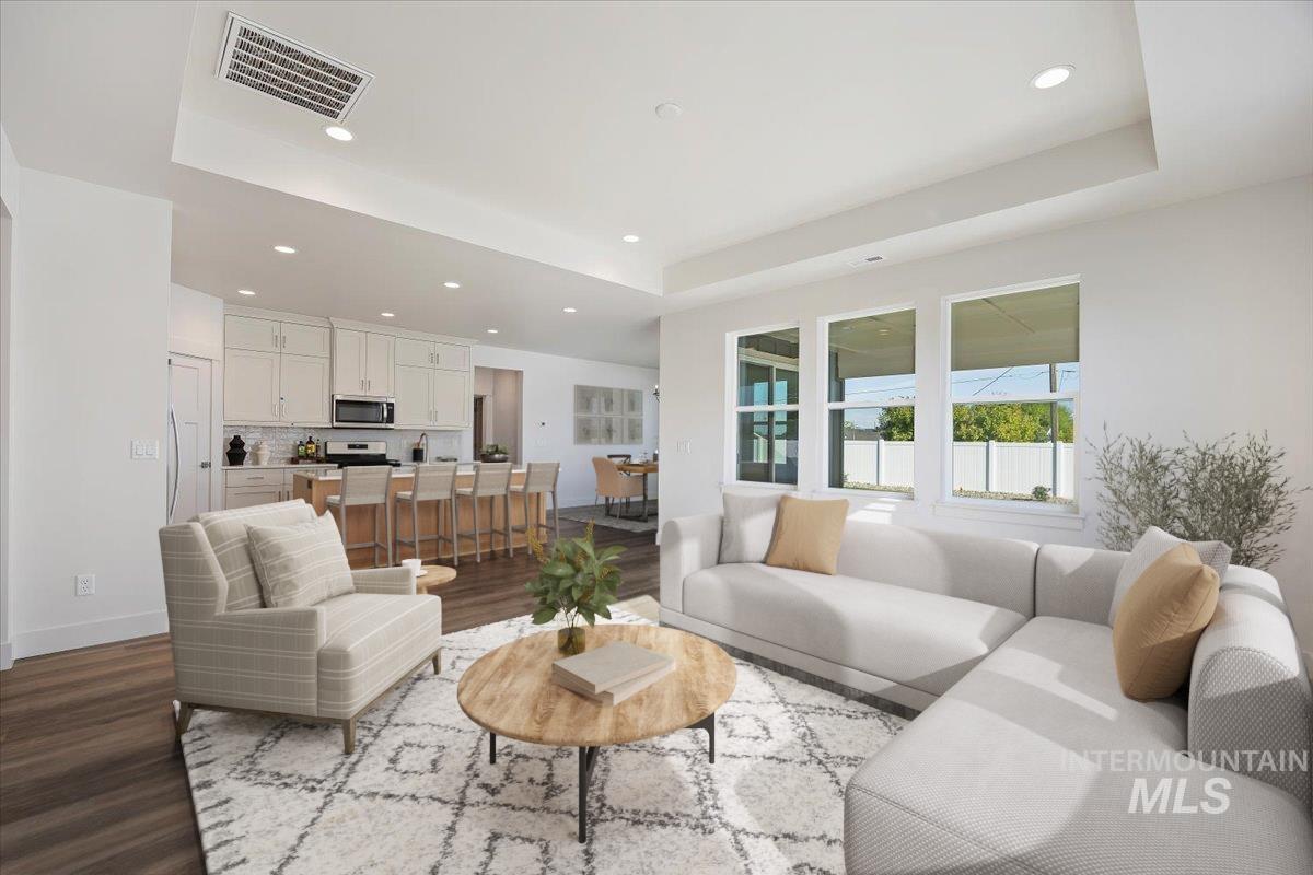178 Maxine Lane, Unit HOMESITE 204 Kimberly, ID 83341 - Photo 12 of 24 Living area featuring dark wood-style flooring, a raised ceiling, and recessed lighting