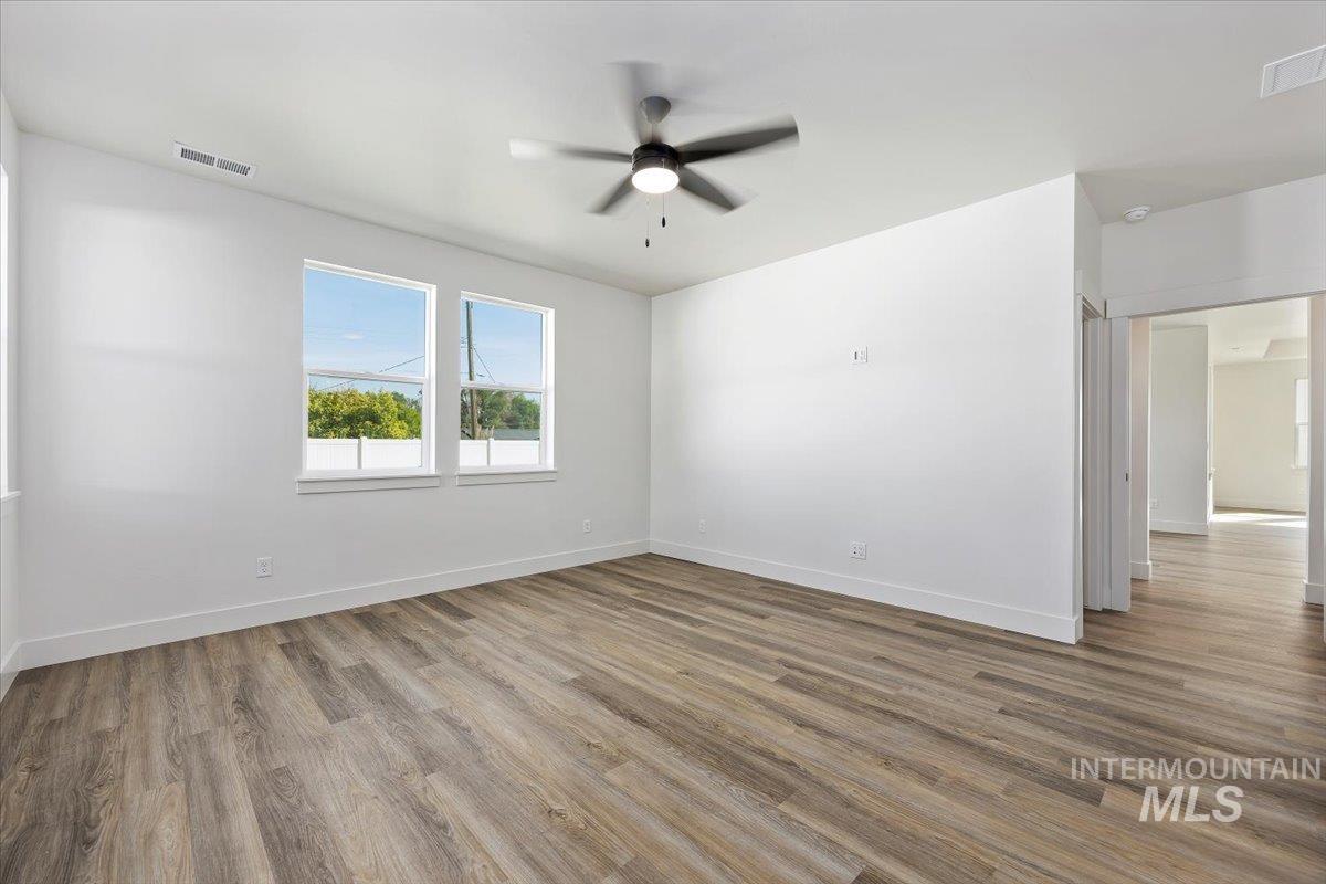 178 Maxine Lane, Unit HOMESITE 204 Kimberly, ID 83341 - Photo 13 of 24 Primary Bedroom featuring light wood-style flooring and ceiling fan.