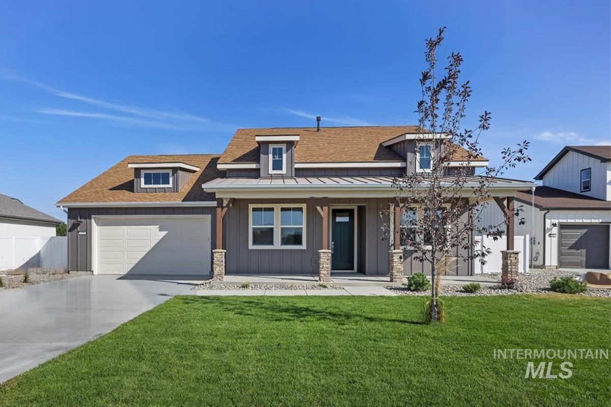 178 Maxine Lane, Unit HOMESITE 204 Kimberly, ID 83341 - Photo 2 of 24 View of front of property featuring covered porch, roof with shingles, board and batten siding, driveway, and a standing seam roof