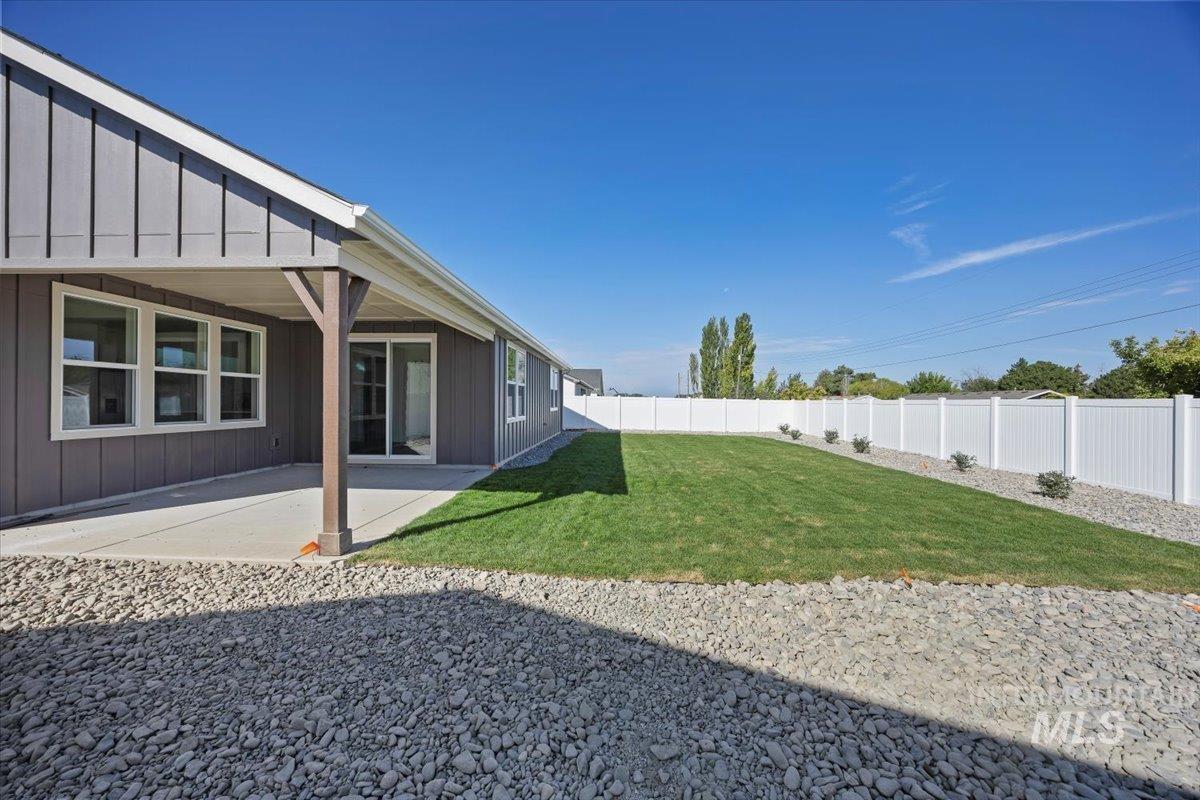 178 Maxine Lane, Unit HOMESITE 204 Kimberly, ID 83341 - Photo 22 of 24 Fenced backyard featuring a patio