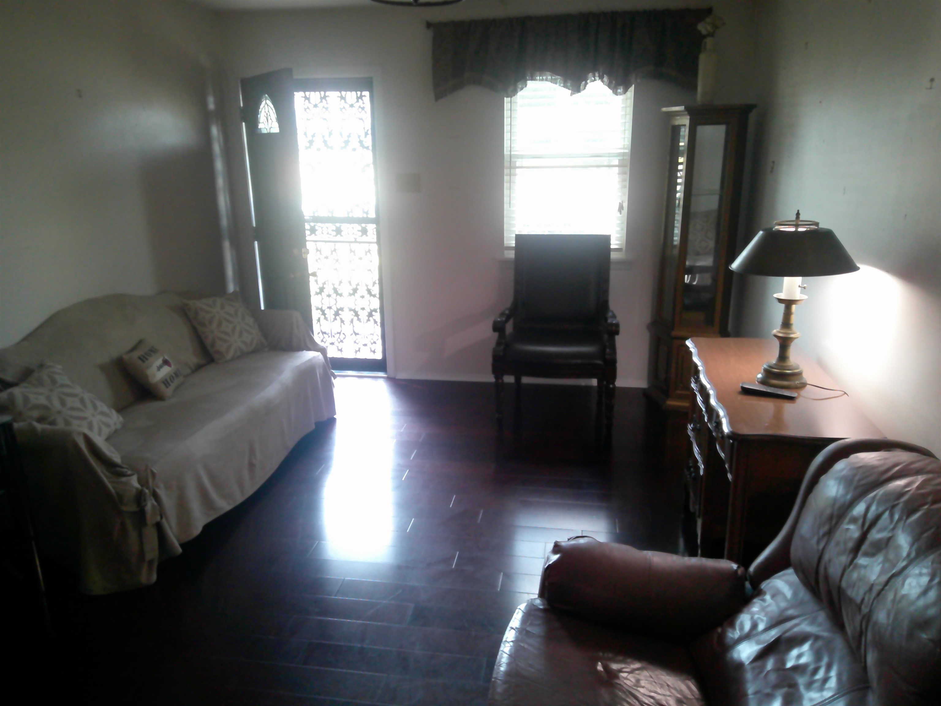 4374 Ford Road Memphis, TN 38109 - Photo 4 of 14 a living room with furniture and a lamp