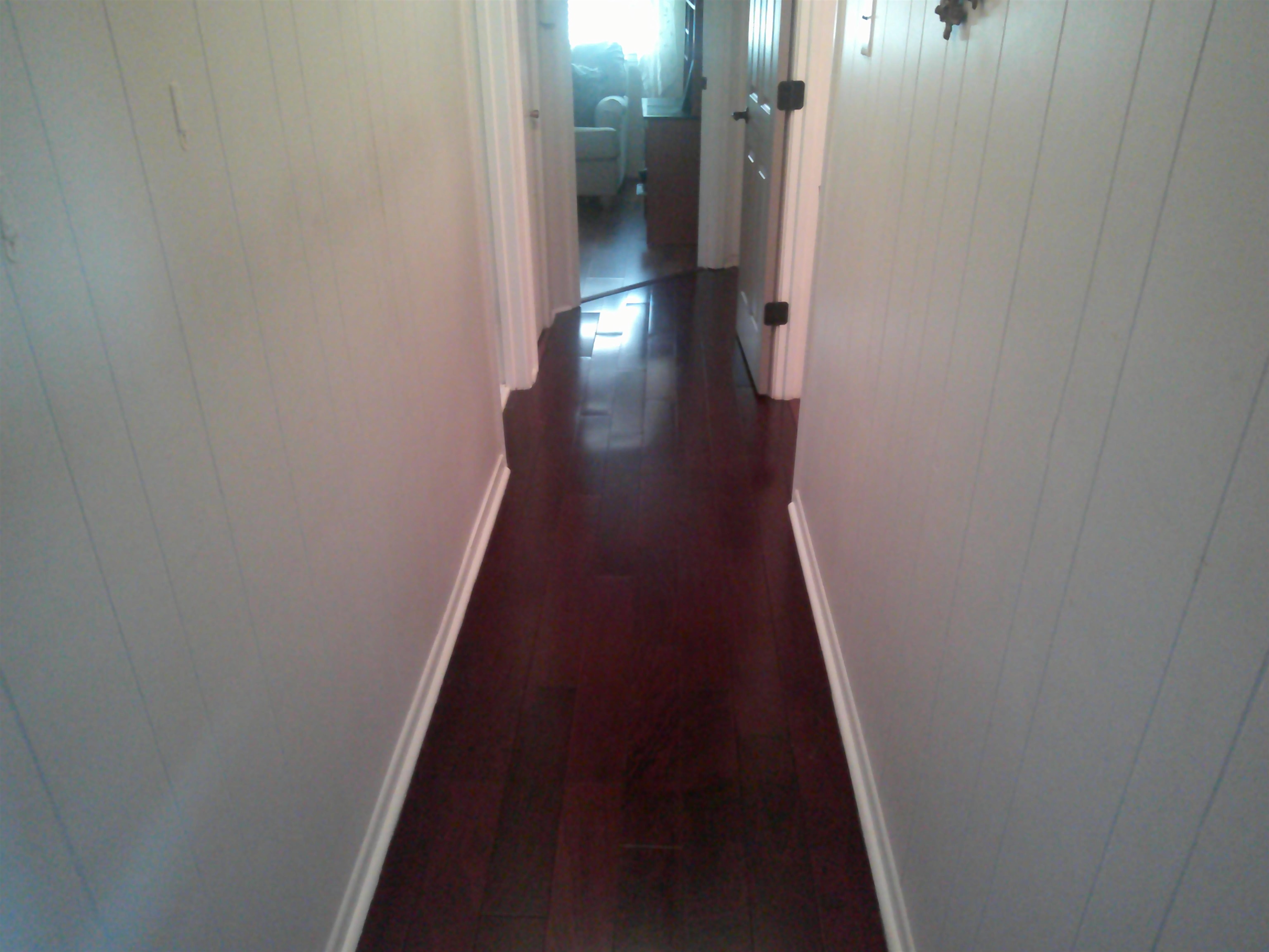4374 Ford Road Memphis, TN 38109 - Photo 6 of 14 a view of a hallway with wooden floor
