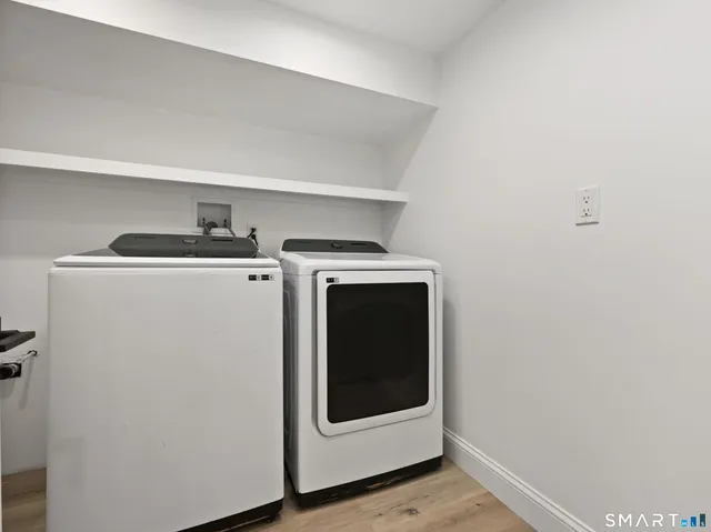 a utility room with dryer and washer