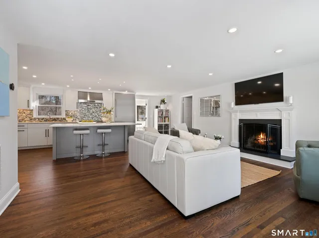a living room with a couch and a fireplace