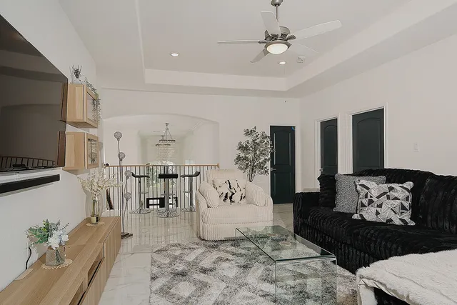 a living room with furniture and a flat screen tv