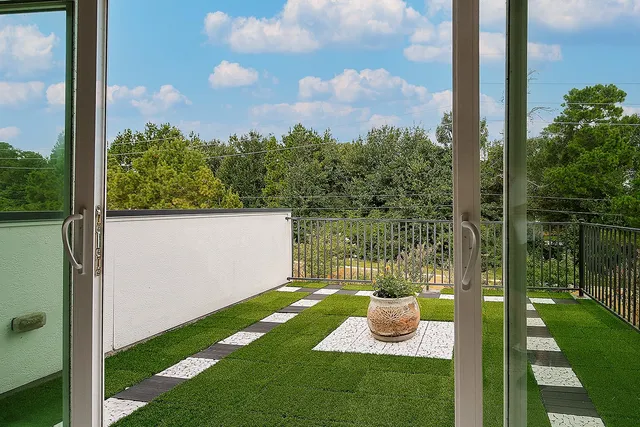 a view of a garden from a balcony