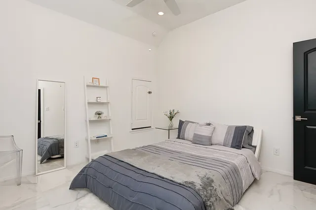 a bedroom with a bed and closet