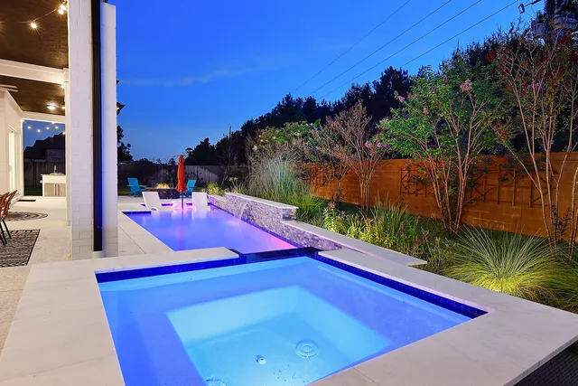a view of a backyard with swimming pool of the house