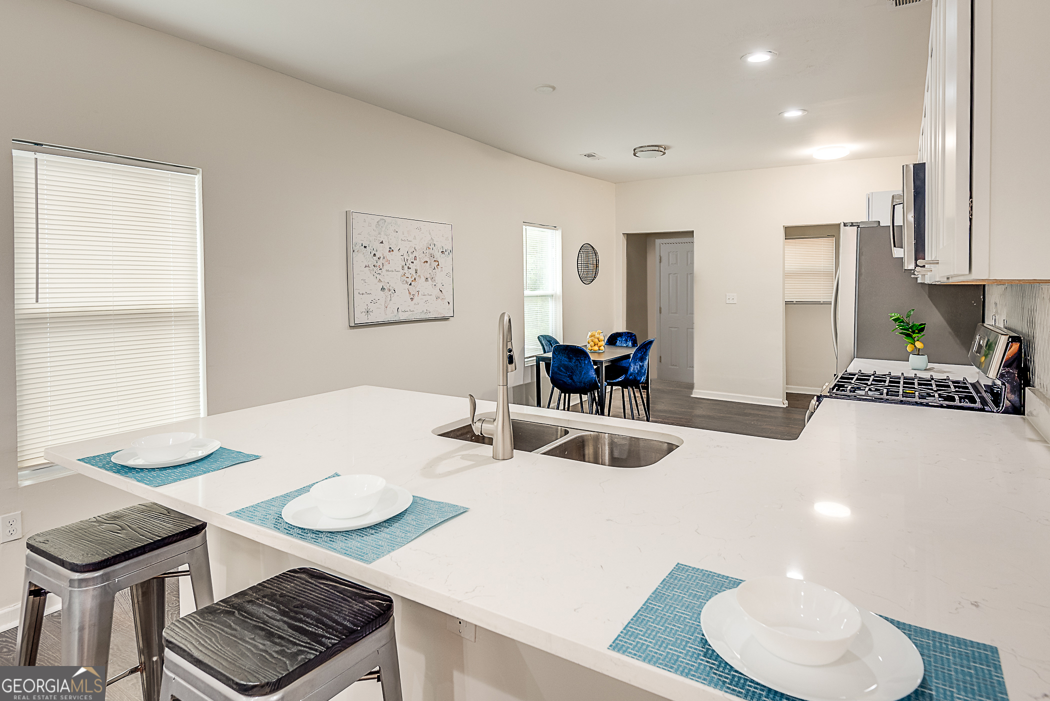 996 Fair Street Southwest Atlanta, GA 30310 - Photo 3 of 8 a kitchen with a table and chairs in it