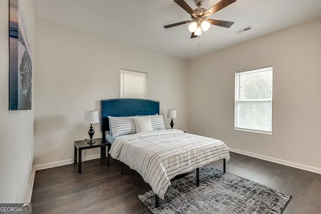 a bedroom with a bed and a table