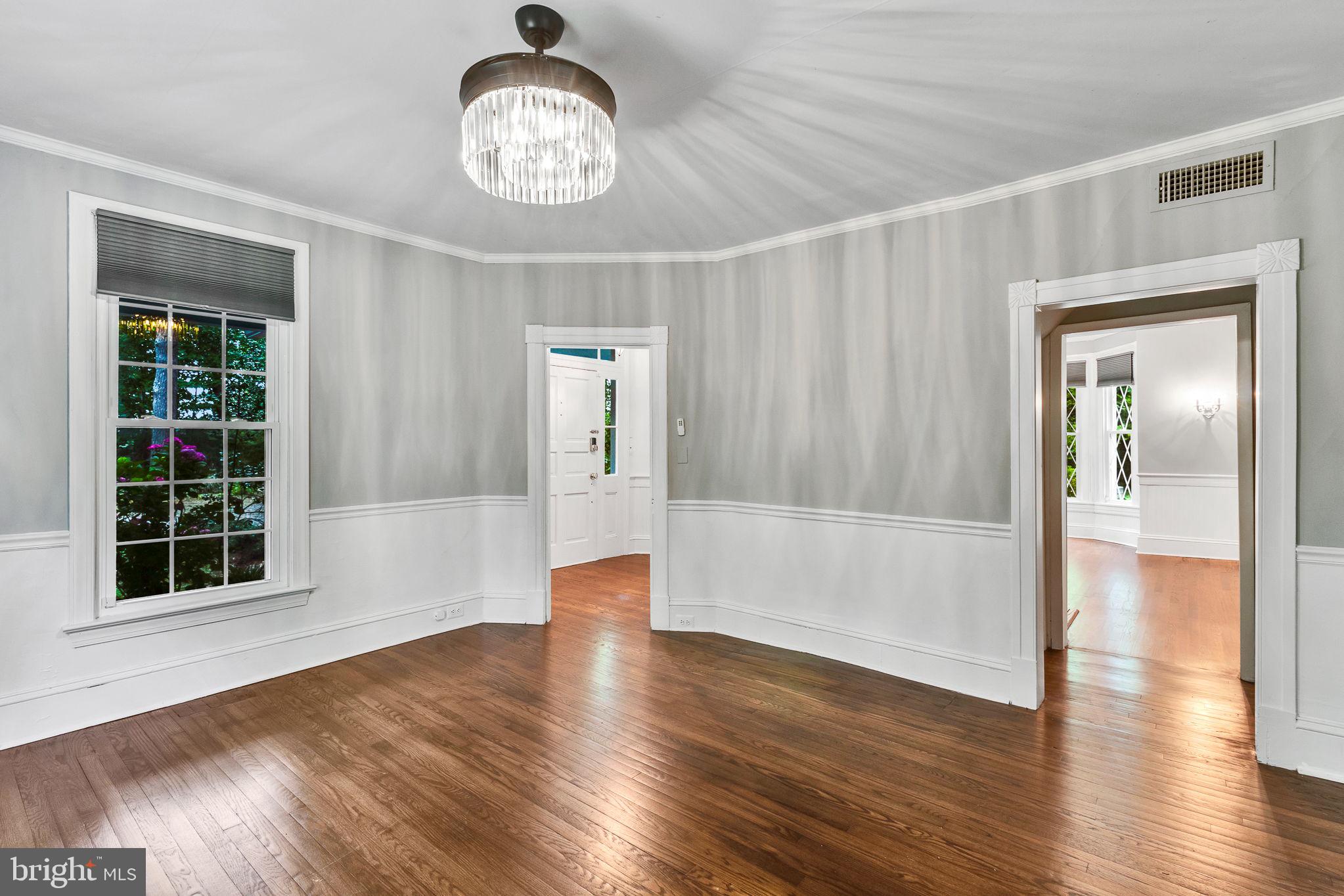 3952 Irvington Road Irvington, VA 22480 - Photo 10 of 77 a view of an empty room with wooden floor and a window