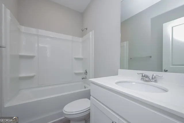 a bathroom with a sink toilet and a bathtub