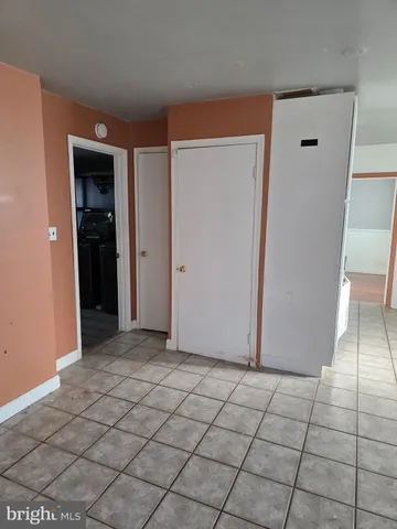 a view of a livingroom with wooden floor and a window