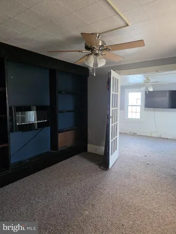 a view of empty room with fan
