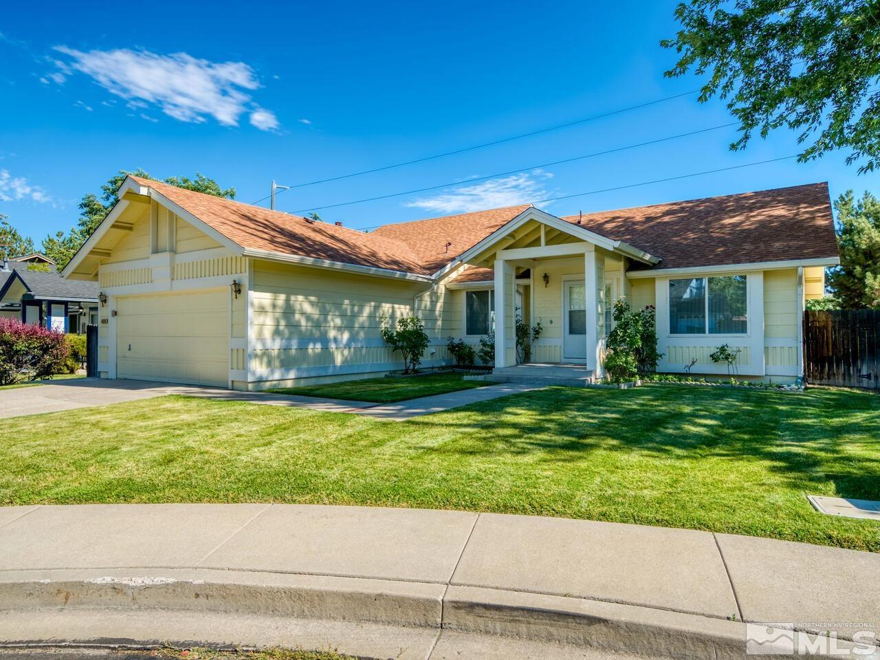 5670 West Rainbow Ridge Court Reno, NV 89523 - Photo 1 of 36 a front view of a house with garden