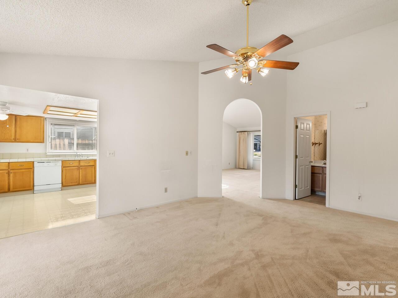 5670 West Rainbow Ridge Court Reno, NV 89523 - Photo 19 of 36 a view of a livingroom with a ceiling fan and window