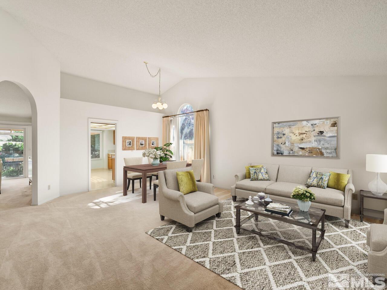 5670 West Rainbow Ridge Court Reno, NV 89523 - Photo 20 of 36 a living room with furniture and a chandelier