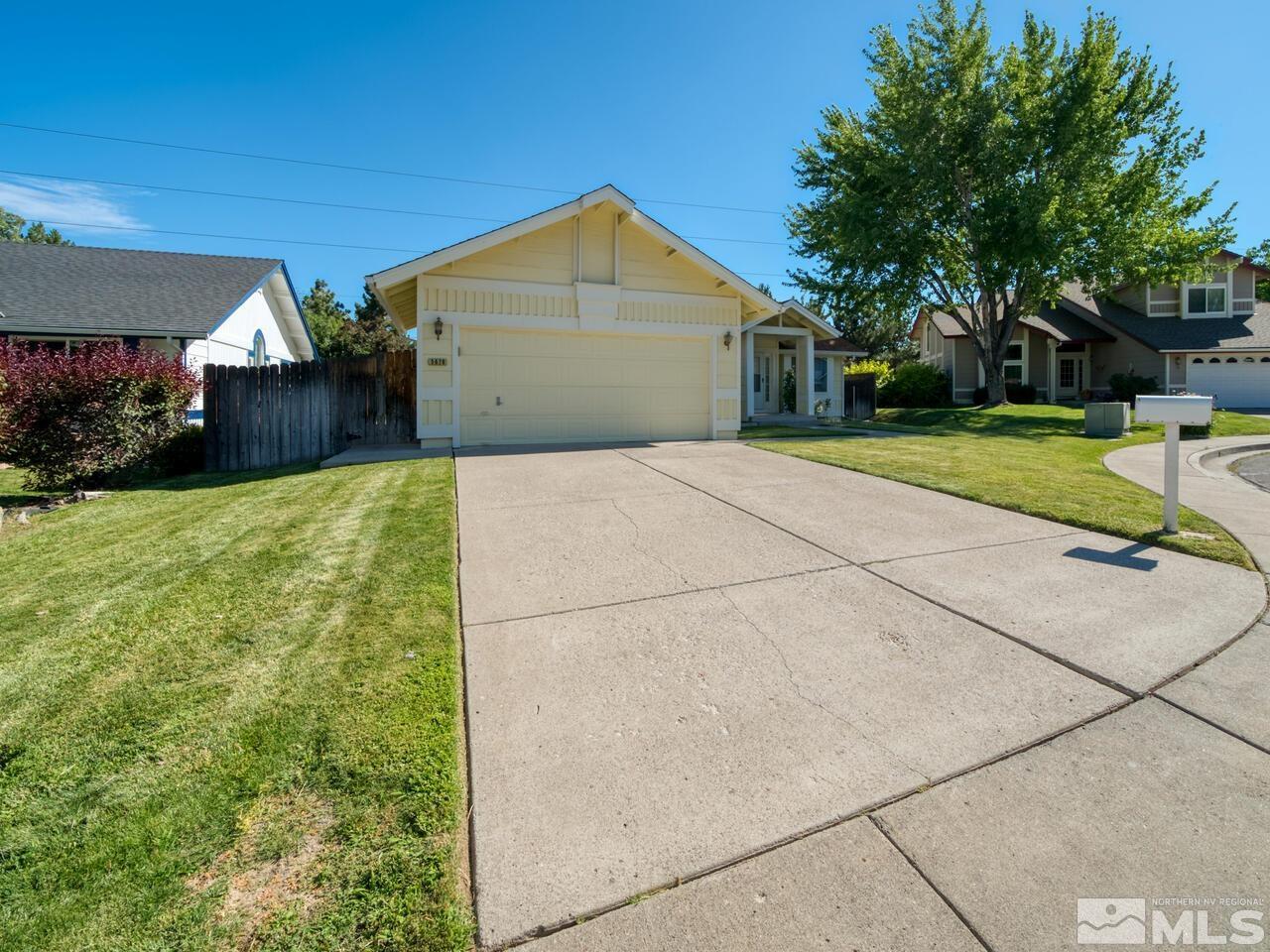 5670 West Rainbow Ridge Court Reno, NV 89523 - Photo 2 of 36 a view of a house with backyard and trees