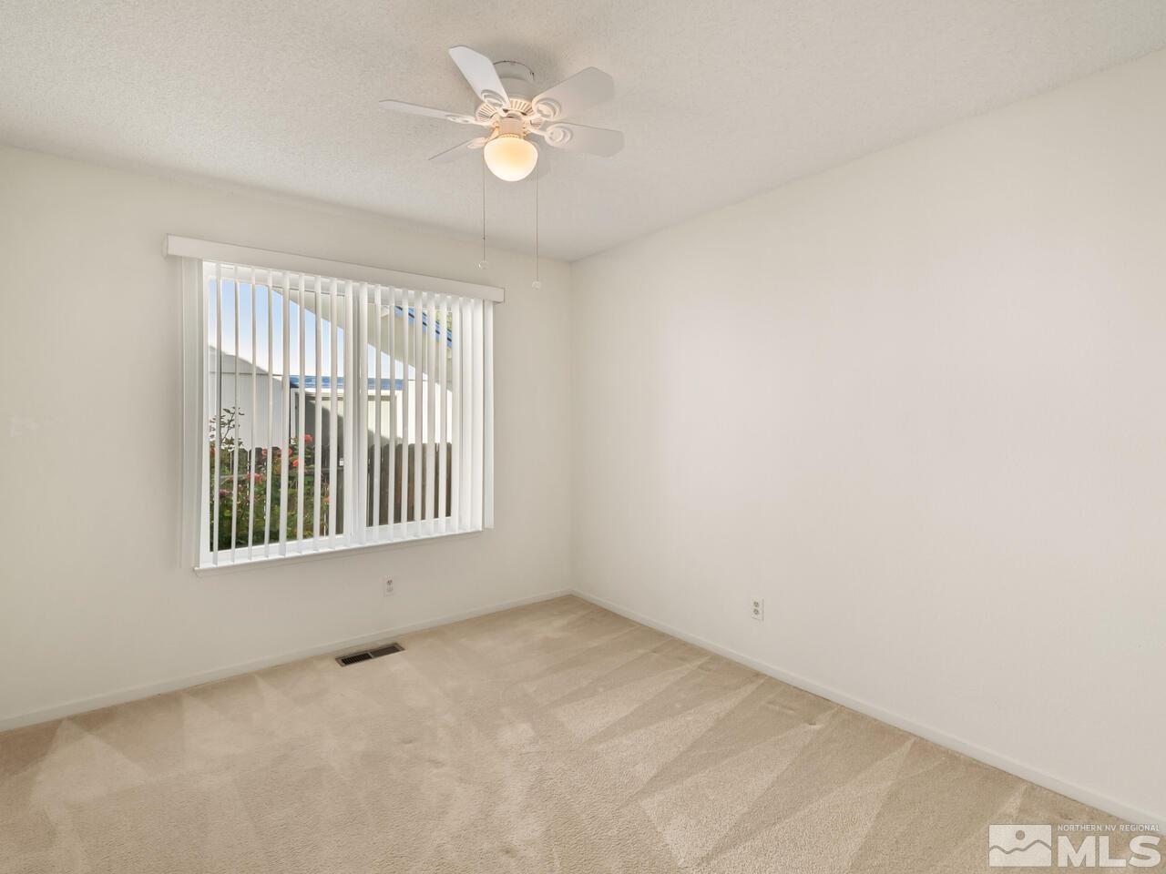 5670 West Rainbow Ridge Court Reno, NV 89523 - Photo 33 of 36 an empty room with a window