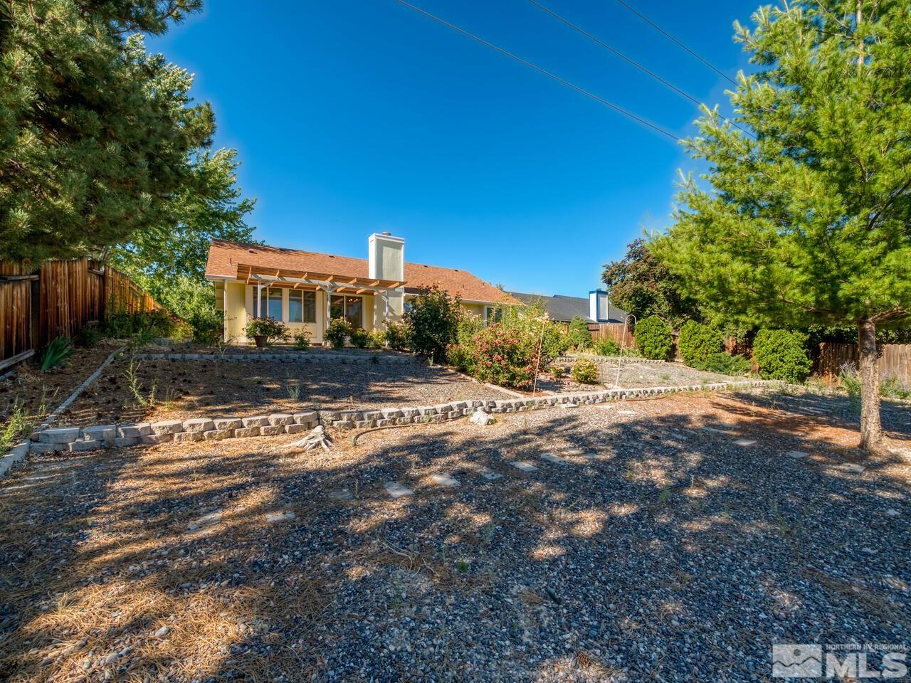 5670 West Rainbow Ridge Court Reno, NV 89523 - Photo 6 of 36 a view of a house with a yard