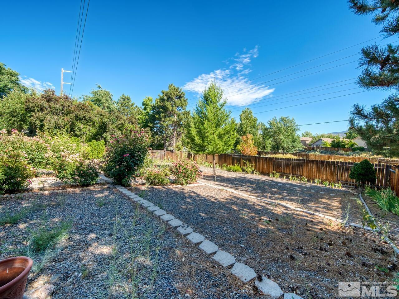 5670 West Rainbow Ridge Court Reno, NV 89523 - Photo 8 of 36 a view of a lake with a big yard