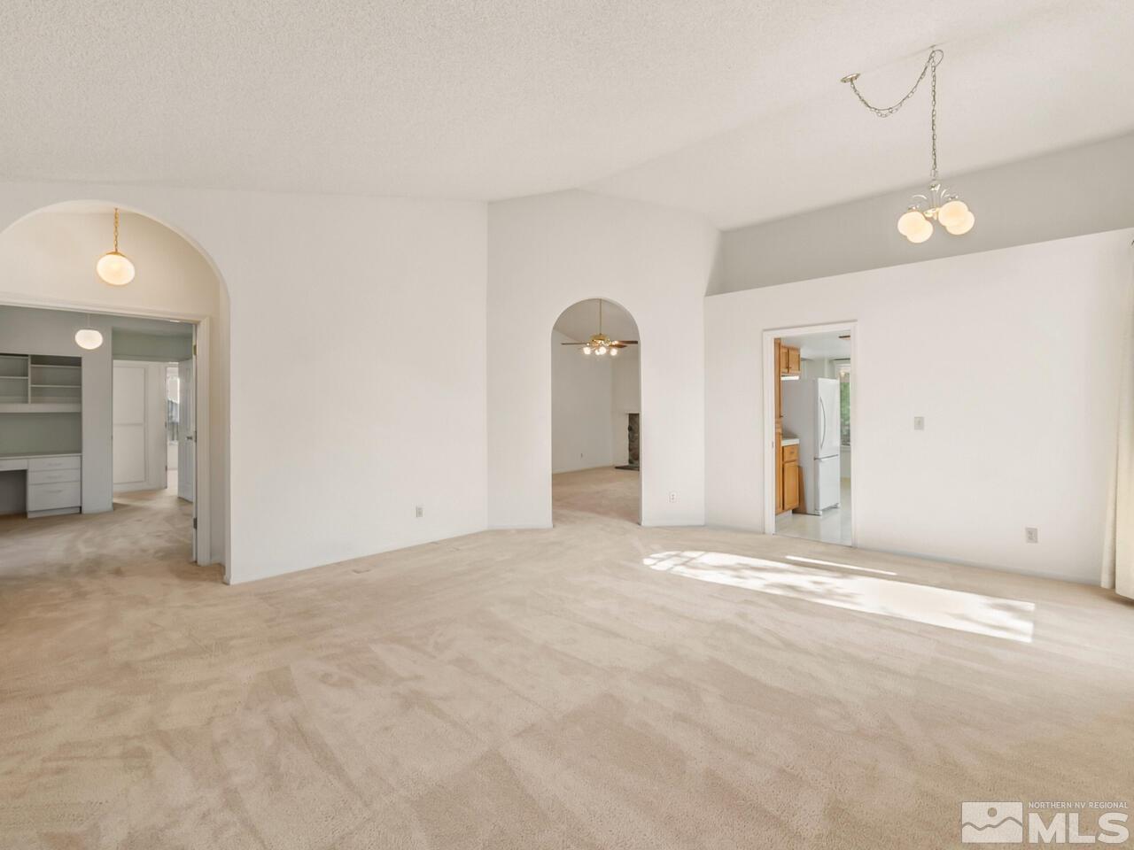 5670 West Rainbow Ridge Court Reno, NV 89523 - Photo 9 of 36 a view of an empty room with window and bathroom