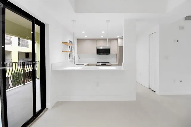 a view of kitchen with wooden floor