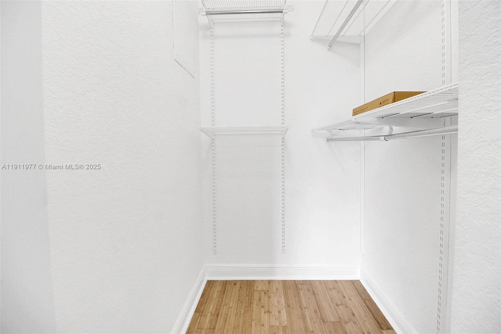 3204 Bird Avenue, Unit 119 Miami, FL 33133 - Photo 21 of 34 a view of walk in closet with clothes