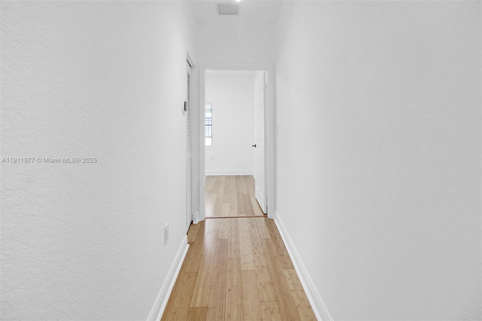 3204 Bird Avenue, Unit 119 Miami, FL 33133 - Photo 22 of 34 a view of a hallway with wooden floor