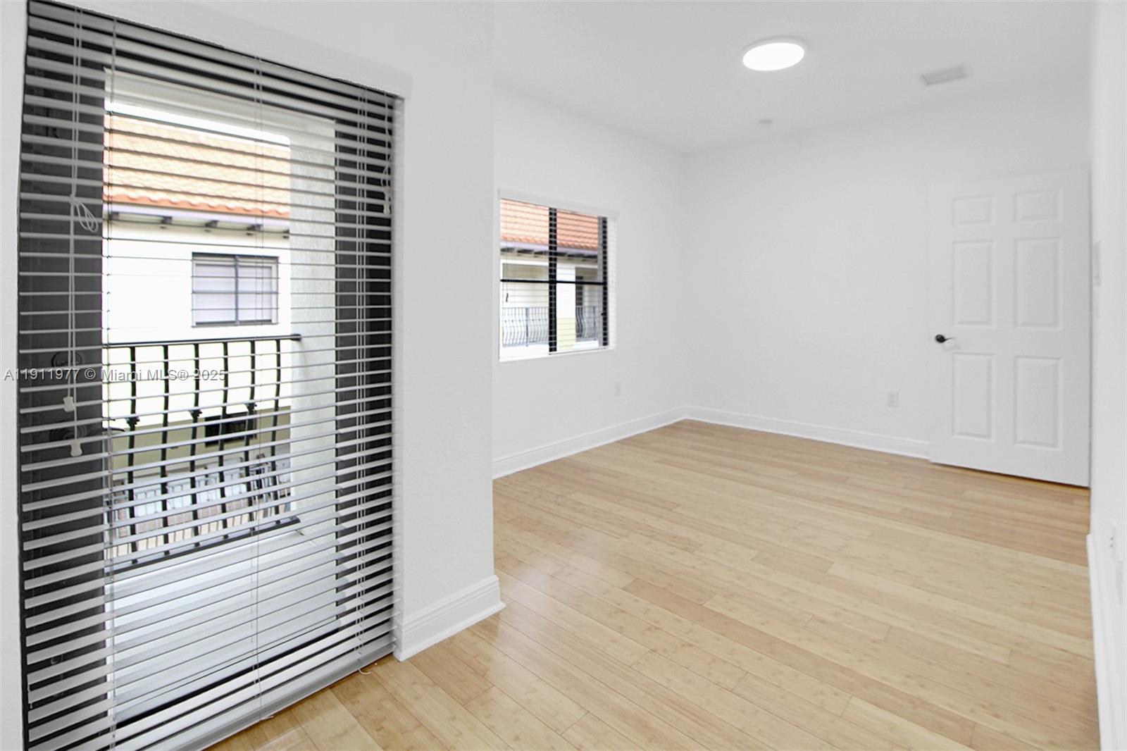 3204 Bird Avenue, Unit 119 Miami, FL 33133 - Photo 24 of 34 a view of empty room with wooden floor and fan