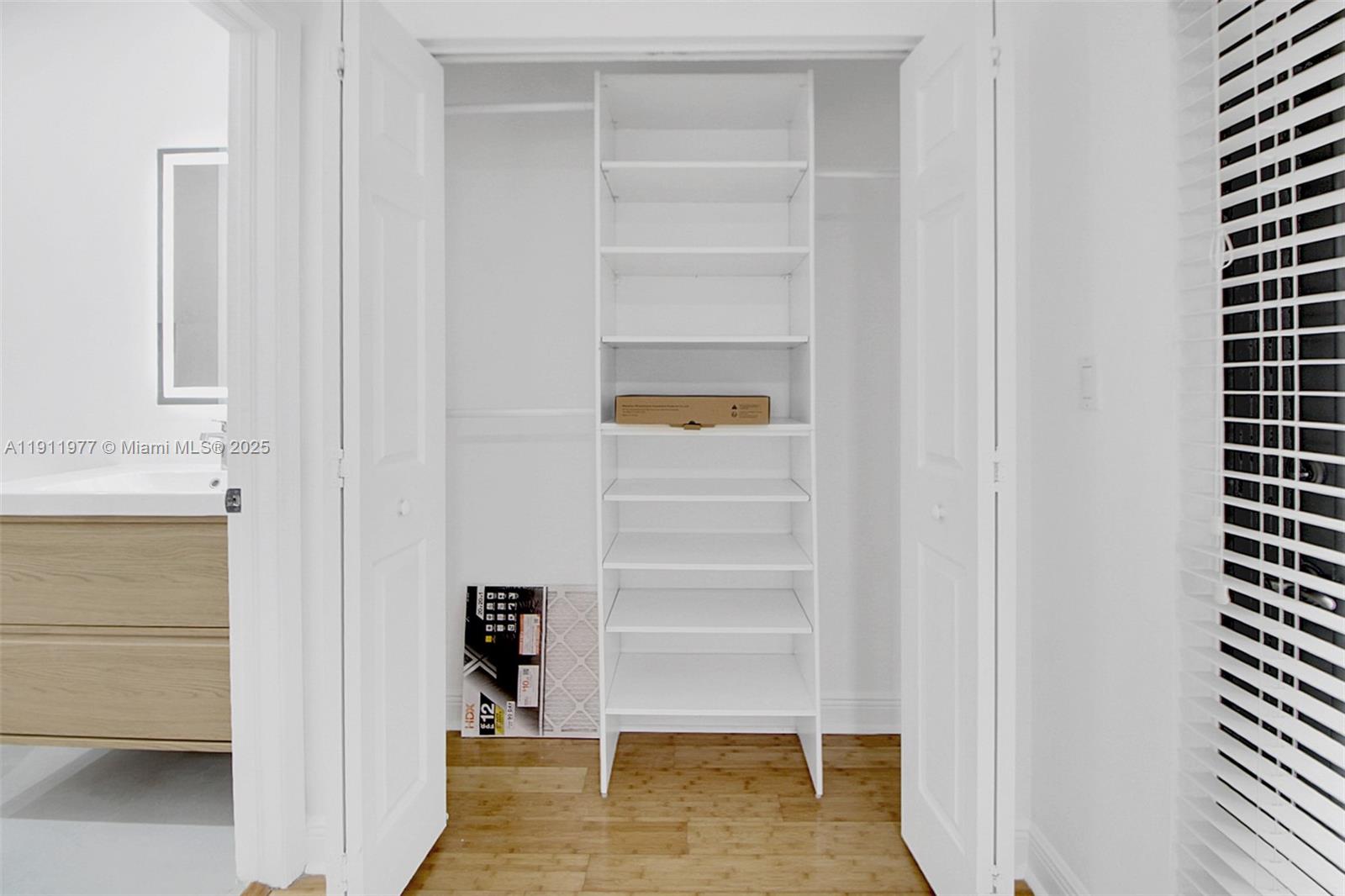 3204 Bird Avenue, Unit 119 Miami, FL 33133 - Photo 27 of 34 a view of walk in closet with empty racks