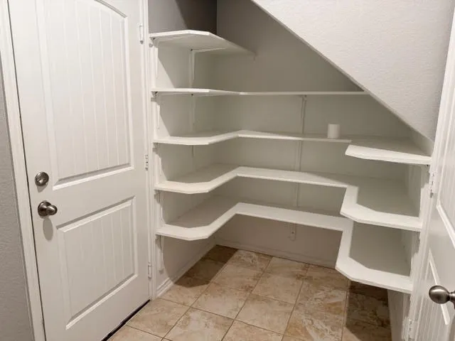 a view of a kitchen with a sink and a microwave