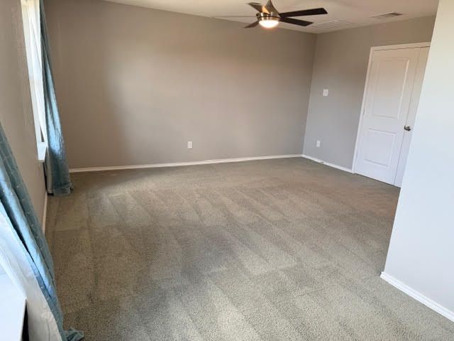 329 Los Cobos Lane Georgetown, TX 78626 - Photo 20 of 40 an empty room with a ceiling fan and window